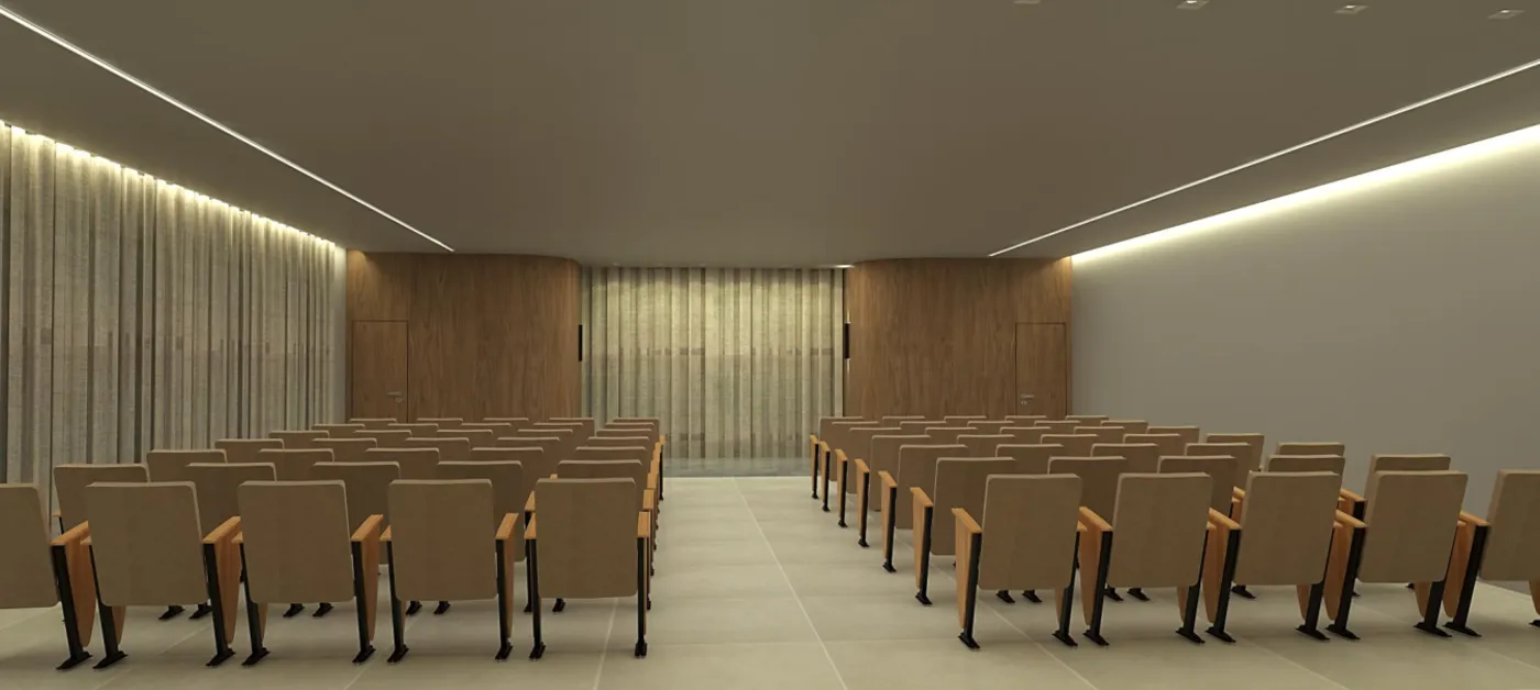 Auditório com fileiras de poltronas e iluminação suave